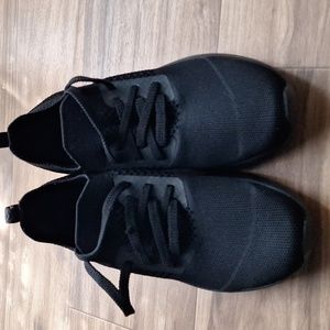 Skeckers Memory Foam black shoes. The shoes are black with soft material.